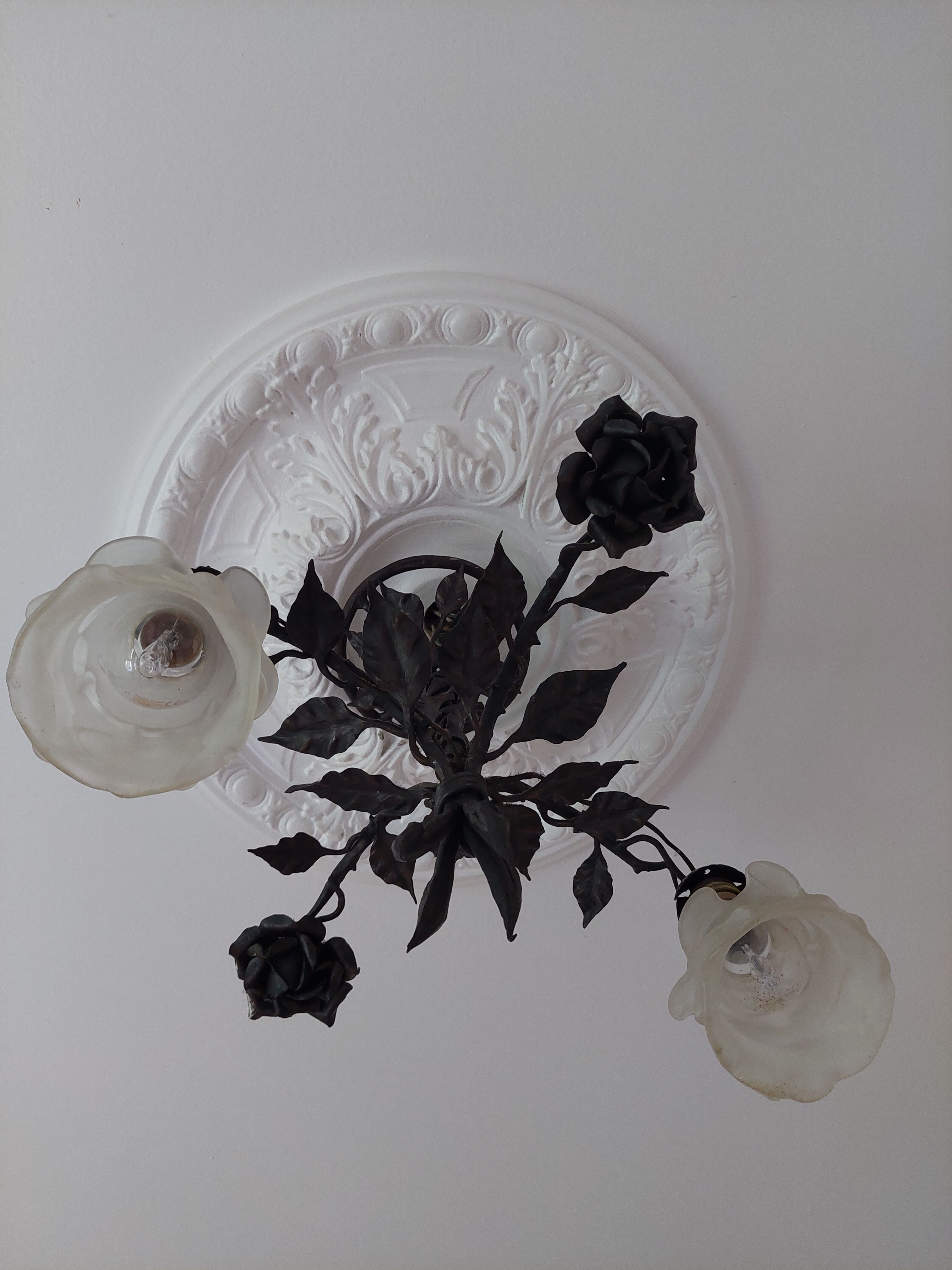 Chandelier with wrought iron and glass rose patterns