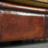 Luxurious and spacious two-seater sheepskin sofa of top quality with fabric cushions
