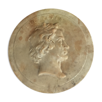 Polished stone medallion depicting Beethoven in profile