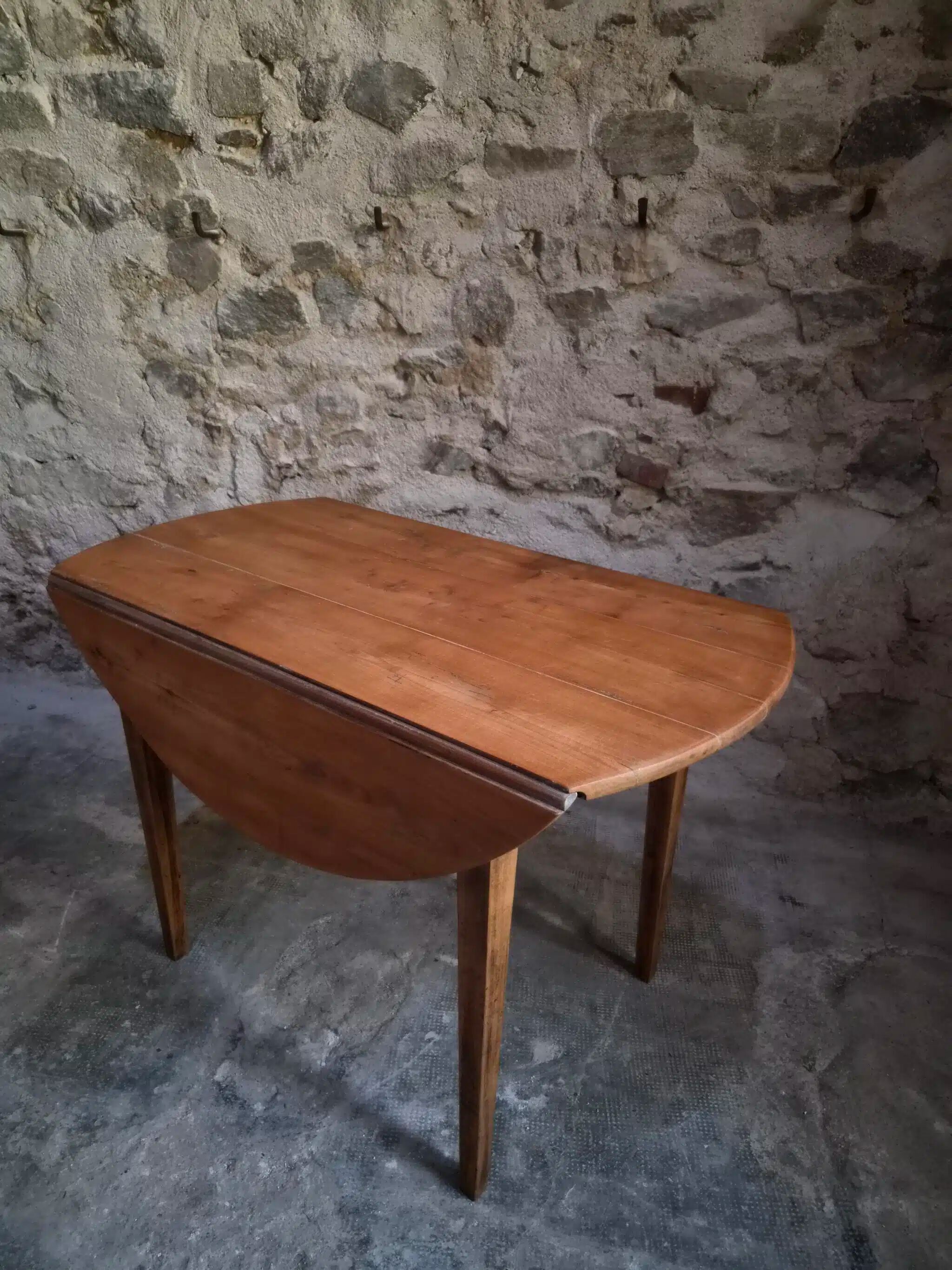 Rustic French antique dining table, drop-leaf table in cherry wood, circa 1900.