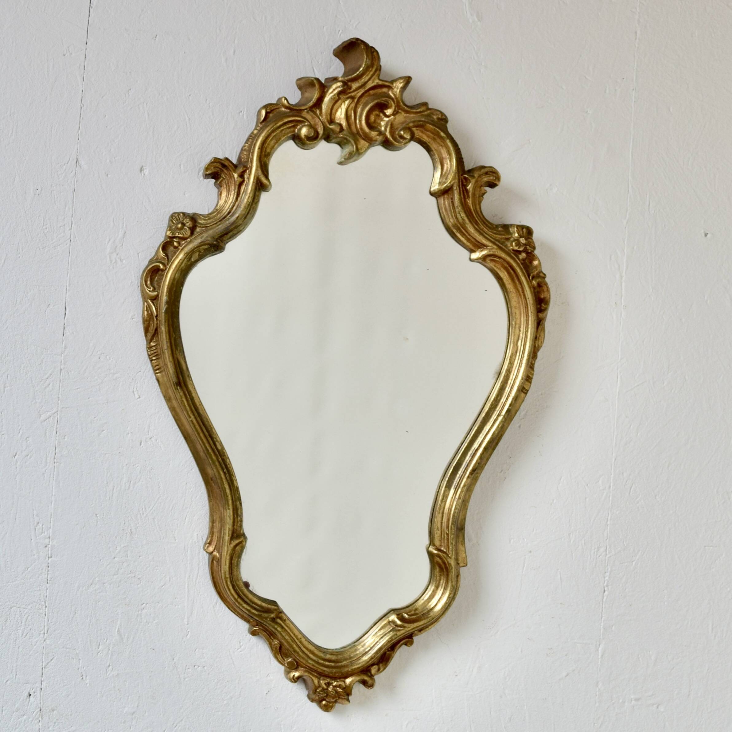 Large rococo mirror in gold painted wood
