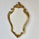 Large rococo mirror in gold painted wood