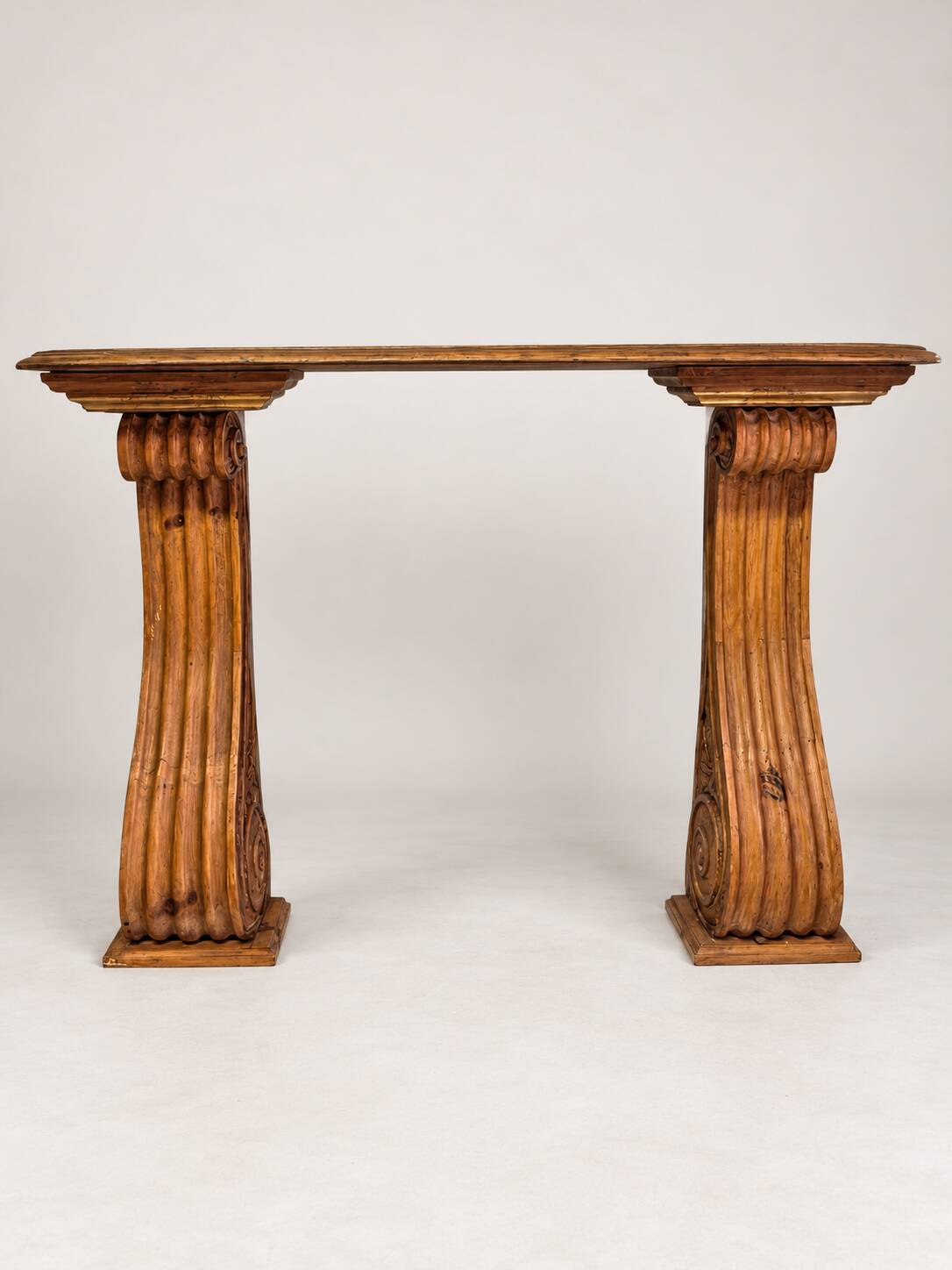 Old console in carved wood with scrolls