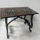 Blackened wood display table with marquetry top, Spain, 19th century.