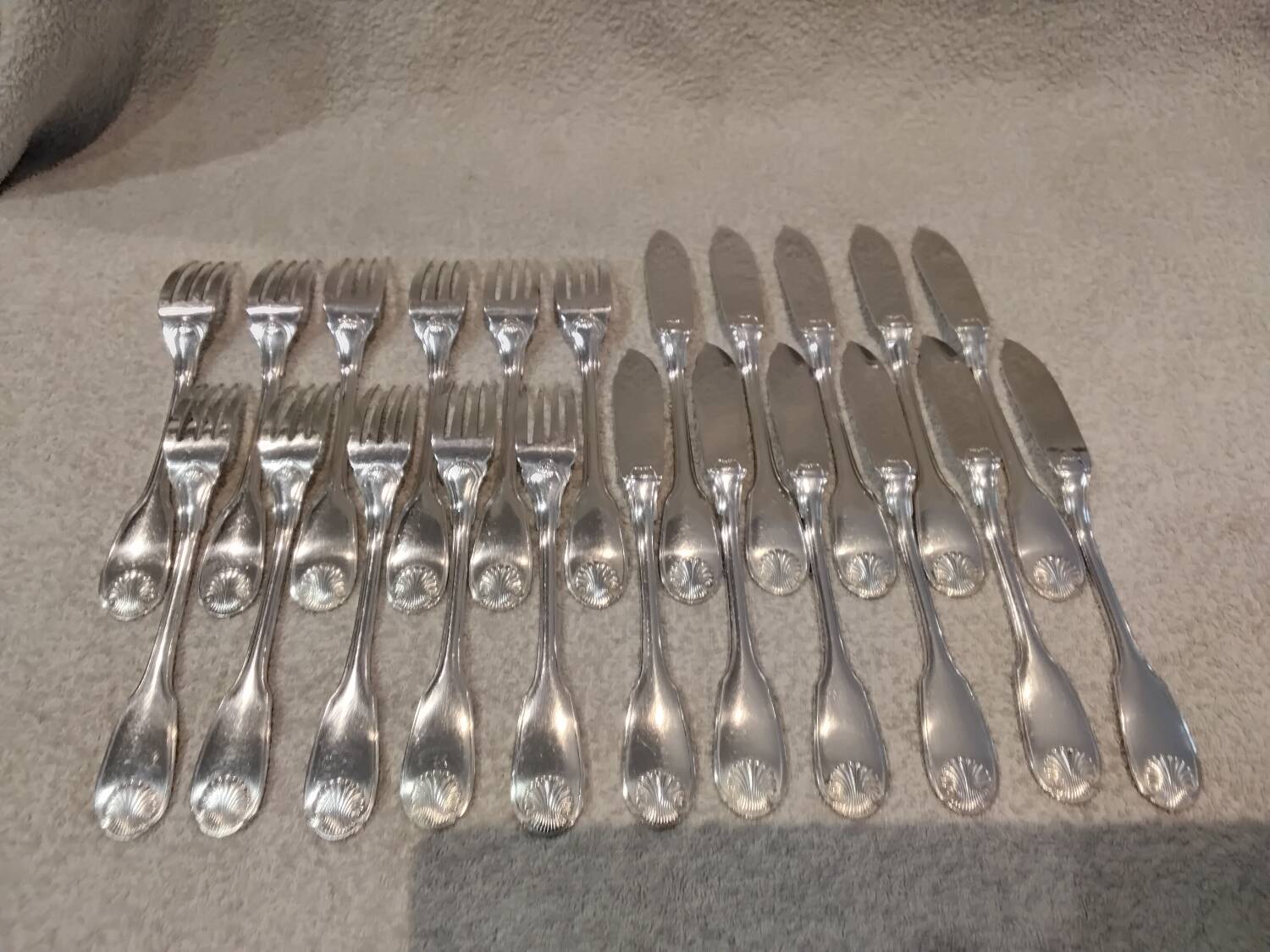 11 silver-plated fish forks and 11 fish knives by Christofle Vendome