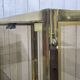 Pair of display cases in gilded chrome and smoked glass - 1980s