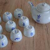 Teapot set and 9 cups with Chinese and French words
