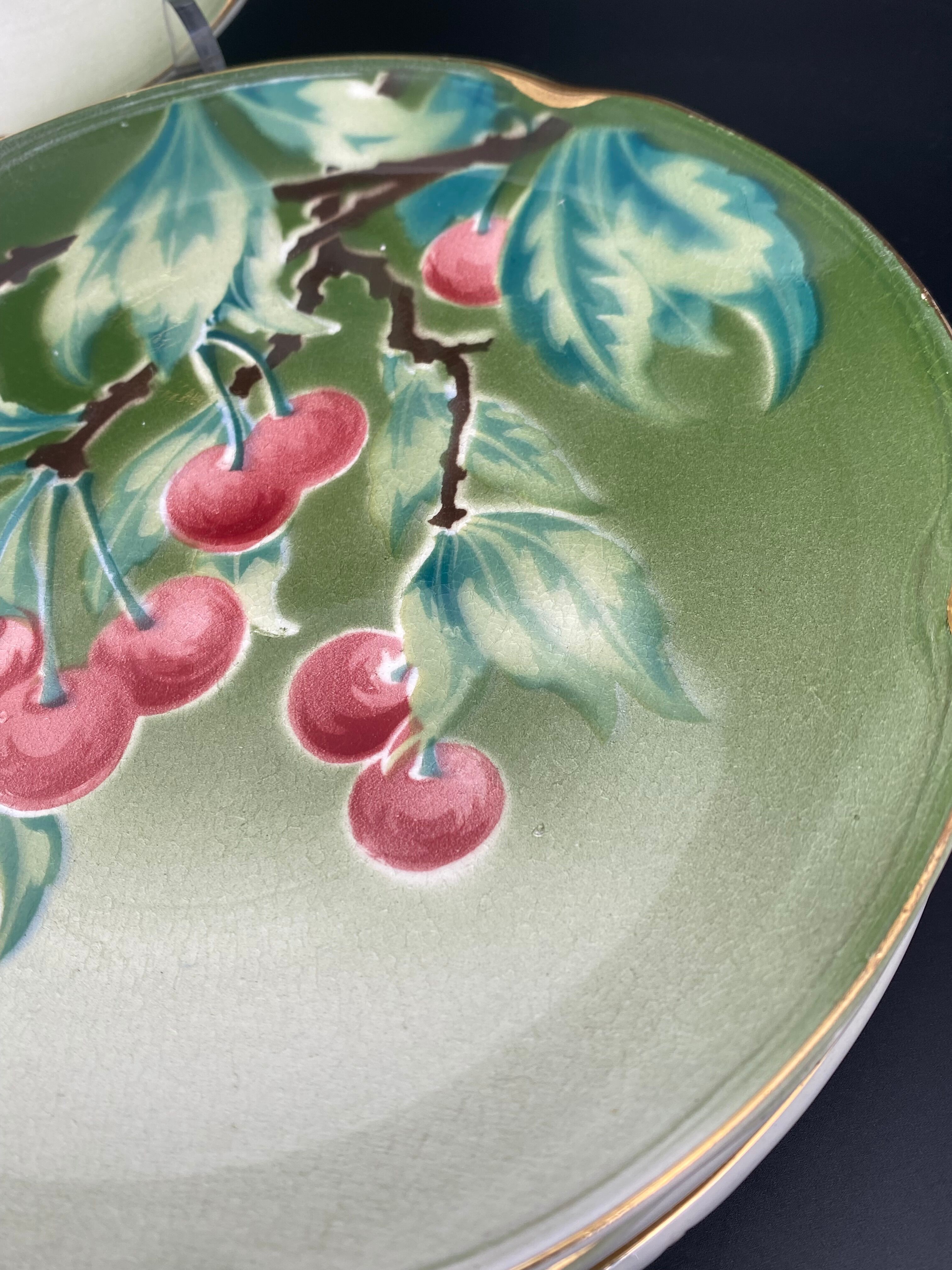 Lunéville cherry plates with golden edges