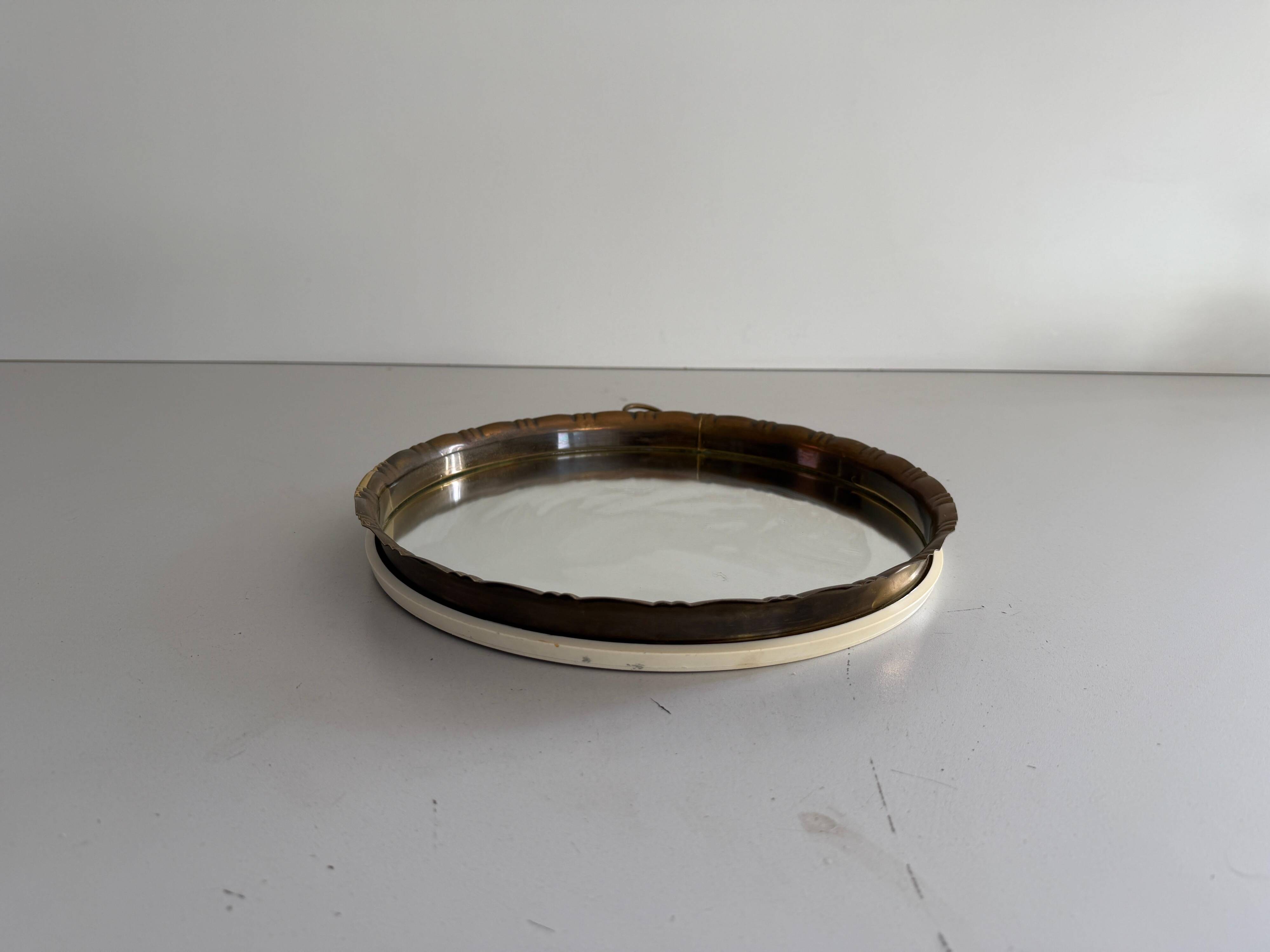 Round wall mirror with brass frame and leather hanger, 1960, Germany