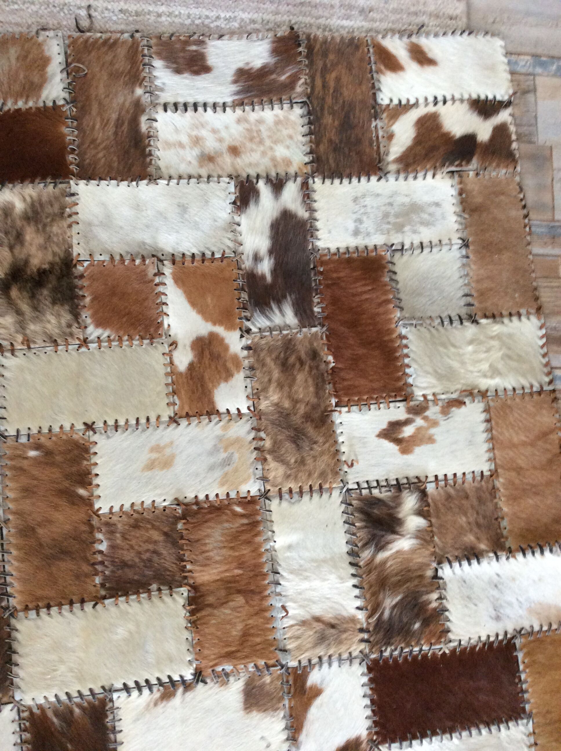 Patchwork carpet in cowhide 164x105cm from the 70s