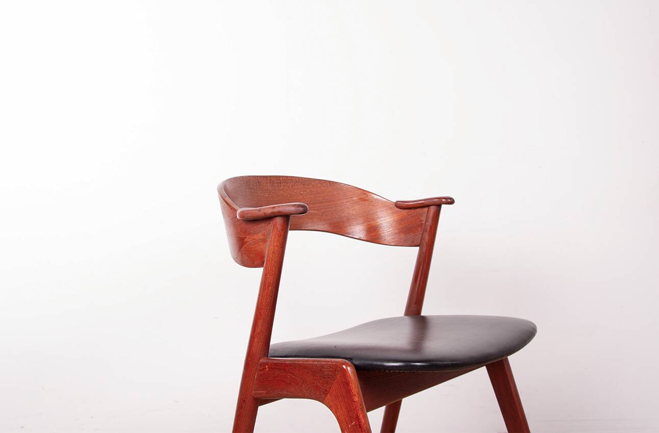 Danish armchair in teak and Skai, by Henning Kjaernulf for Korup Stolefabr.