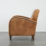 Luxury armchair made of cowhide leather with a beautiful warm colour scheme