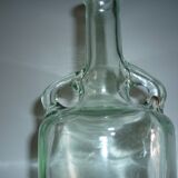 Bouteille ancienne en verre moulée transparente