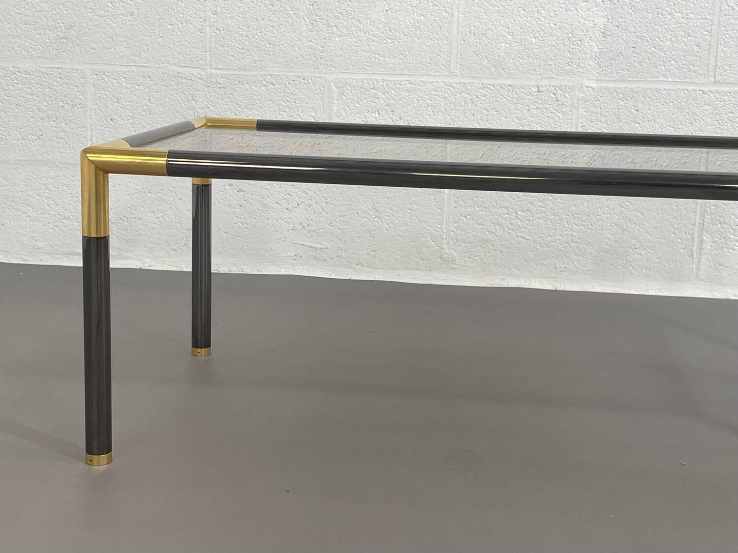 Gunmetal gold metal and smoked glass coffee table from the 70s