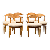 Henning Kjærnulf dining chairs set in Oak and Sheepskin, Denmark, 1960s