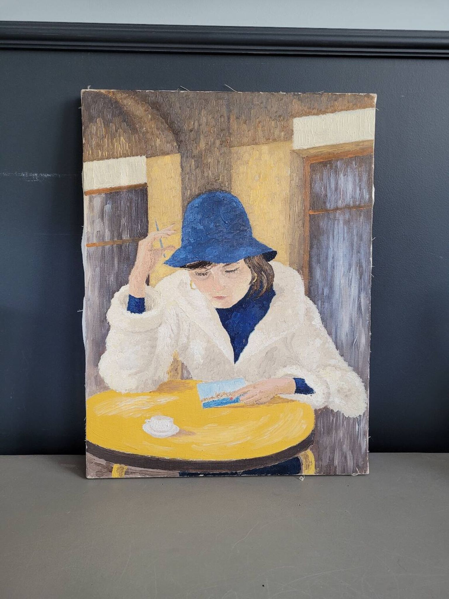 Oil on canvas portrait of a woman writing a postcard