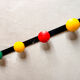 Vintage metal coat rack with colourful plastic hooks, 1960s.