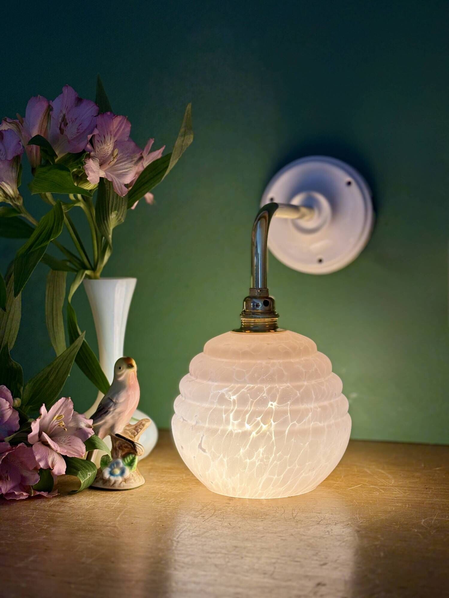 Vintage pink Clichy glass globe wall light.
