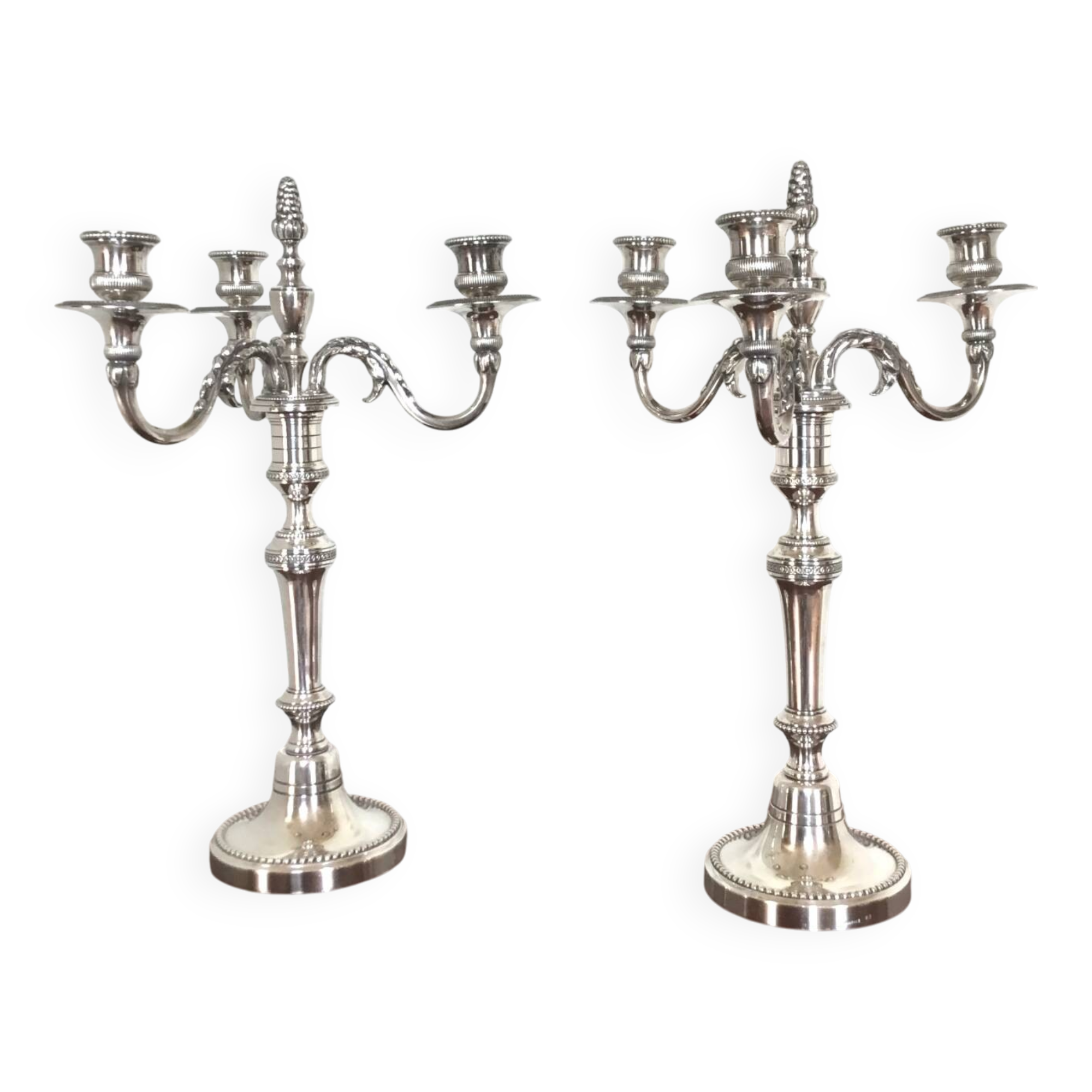Pair of Louis XVI style silver-plated metal candelabras. Chrysalia house