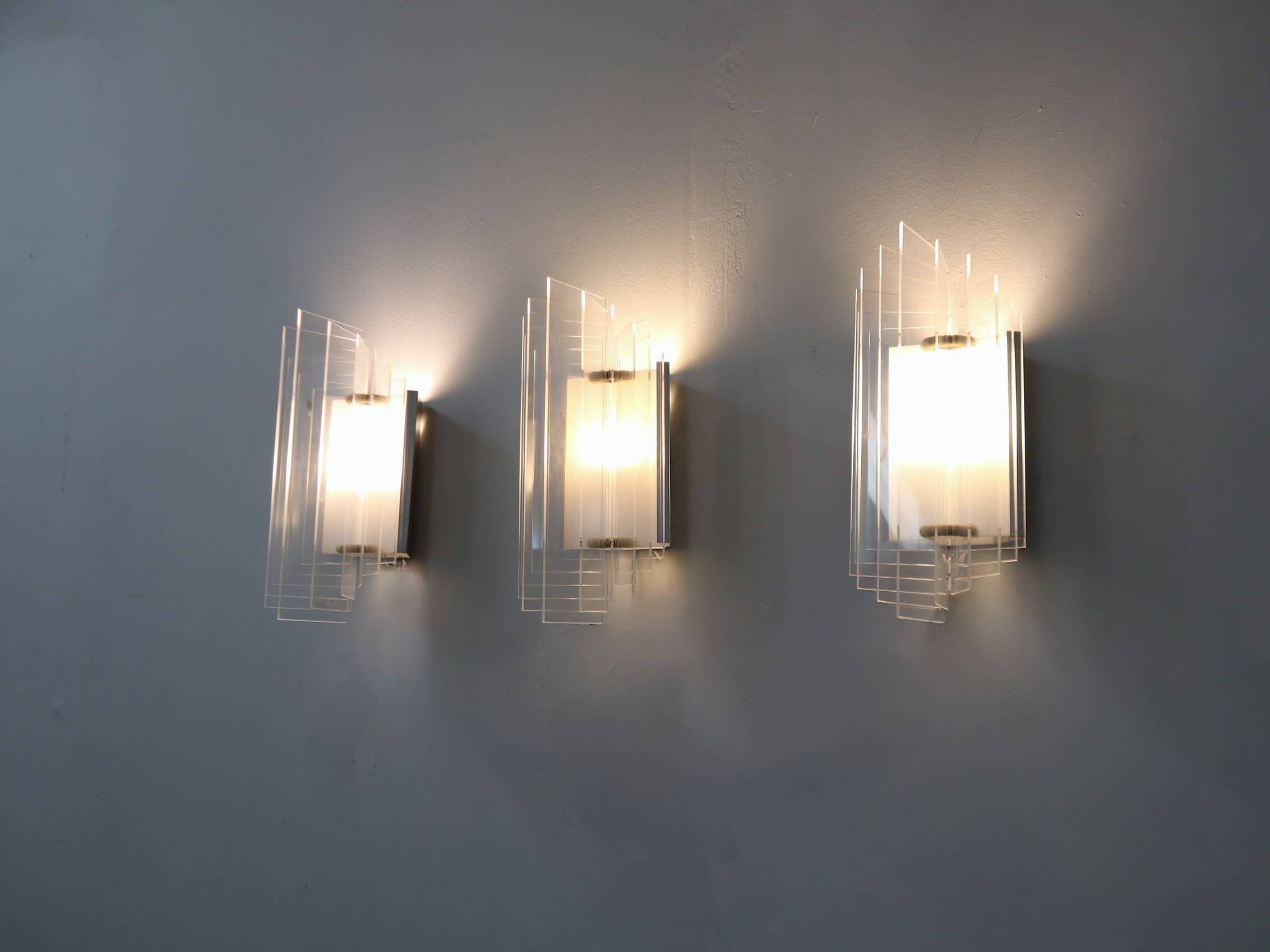 Set of 3 Italian chrome and acrylic blades wall sconces 1970s