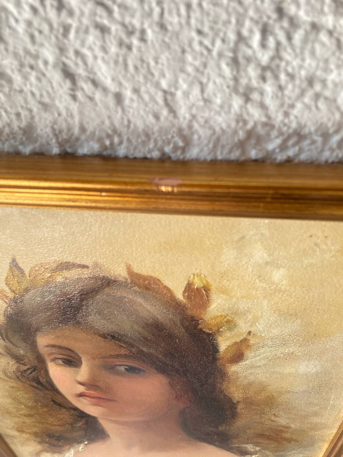 Portrait of a young woman with a laurel crown.