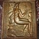 Carved oak panel depicting an allegorical female figure.