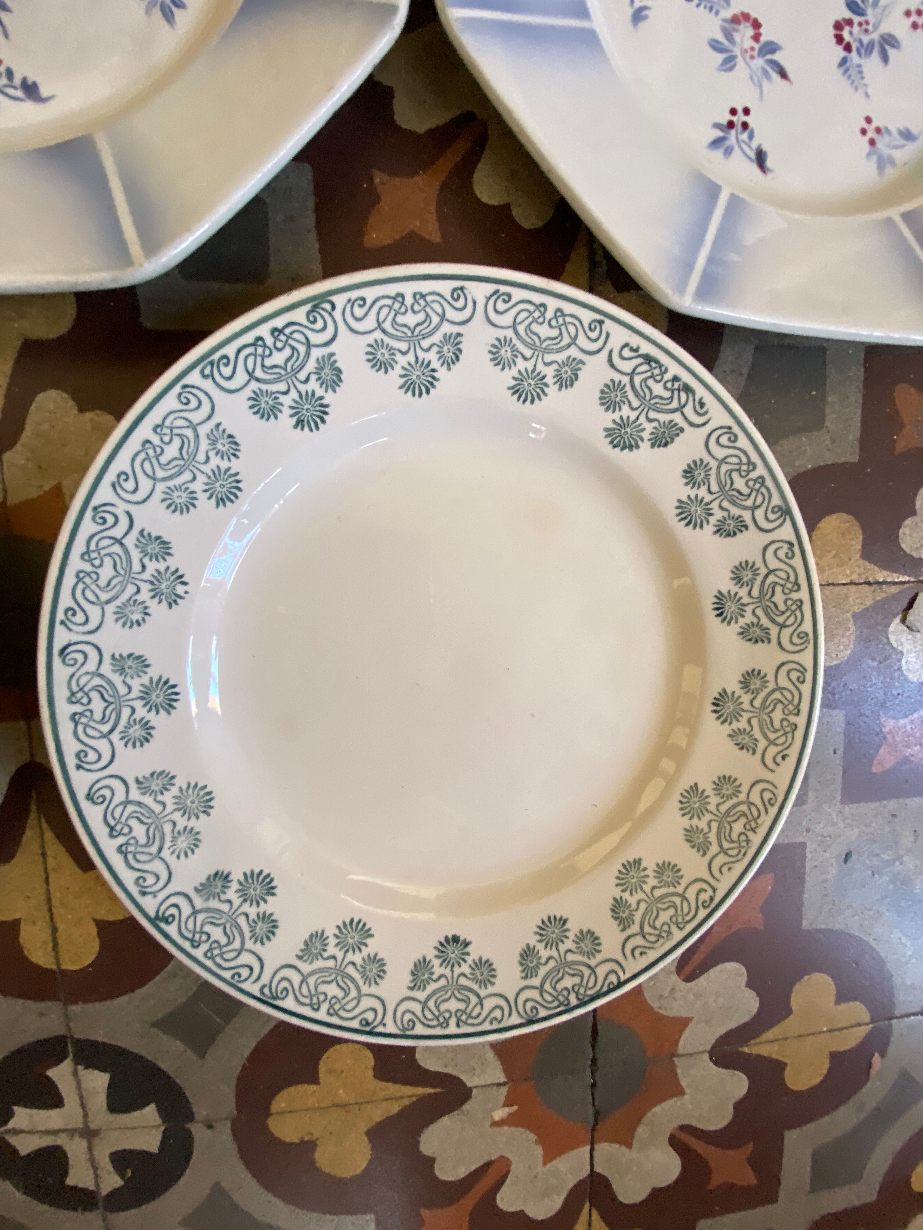 7 matching dessert plates in red green and blue.