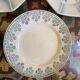 7 matching dessert plates in red green and blue.