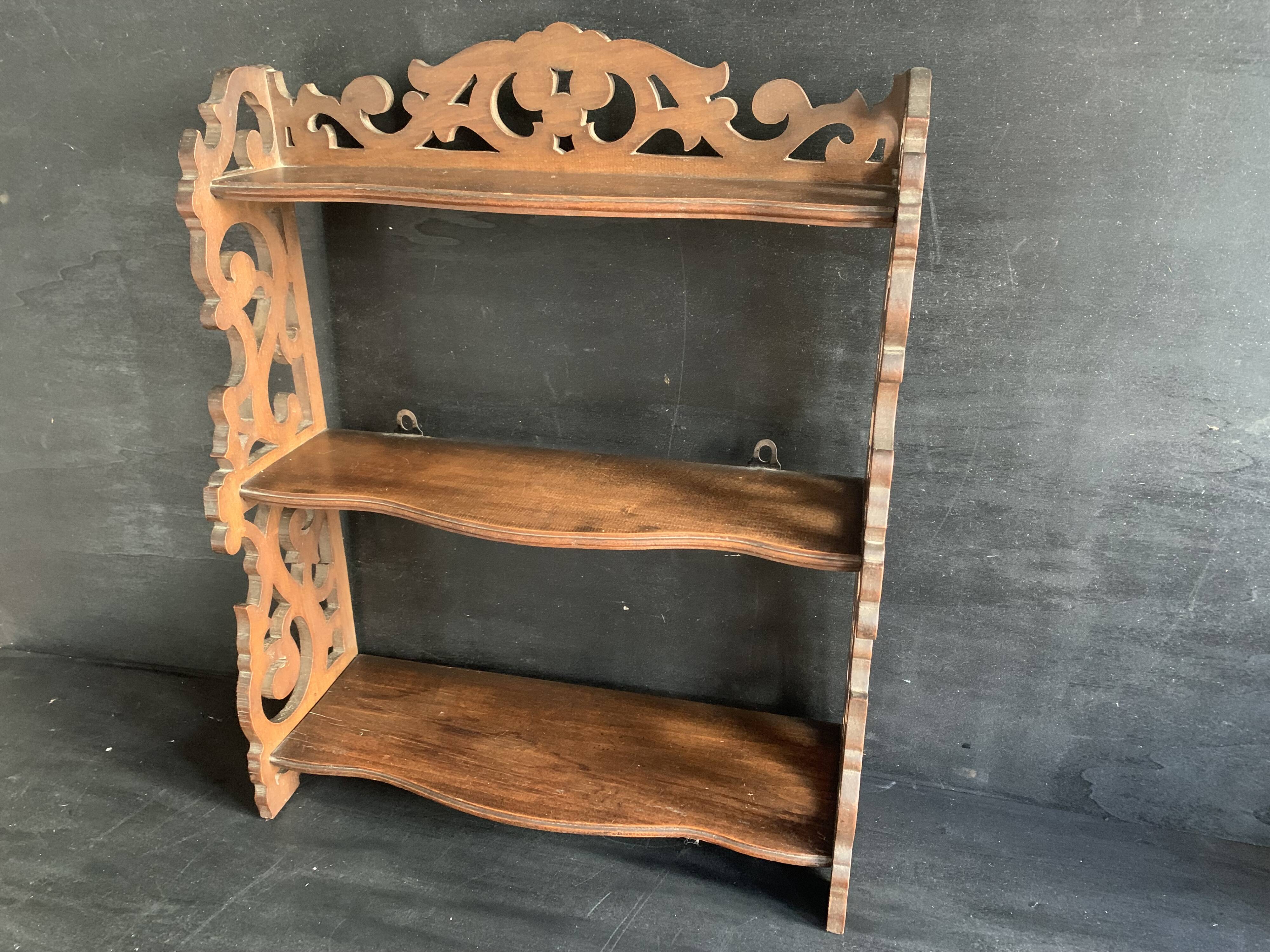 Antique shelf with openwork wooden pediment, early 20th century
