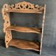 Antique shelf with openwork wooden pediment, early 20th century