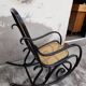Rocking-chair noir canné bois courbé 1930
