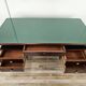 Art Deco executive desk in exotic wood, glass, and brass.