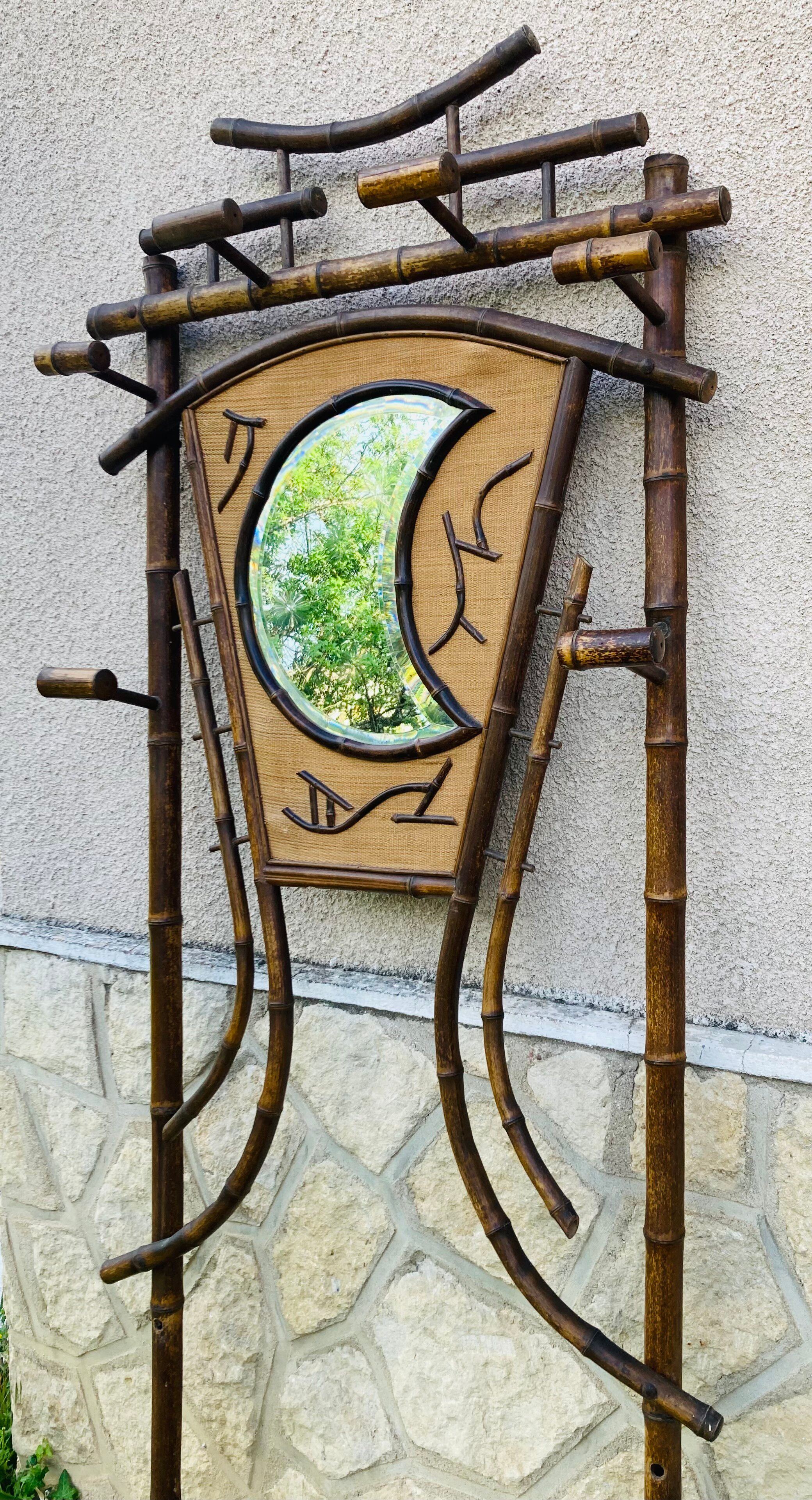 Bamboo coat rack from the 19th century, mirror in the shape of a crescent moon.
