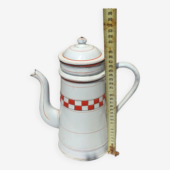 Old enameled coffee pot with checkered decoration