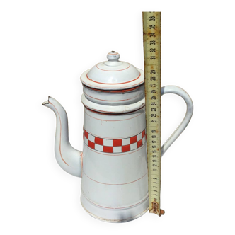 Old enameled coffee pot with checkered decoration
