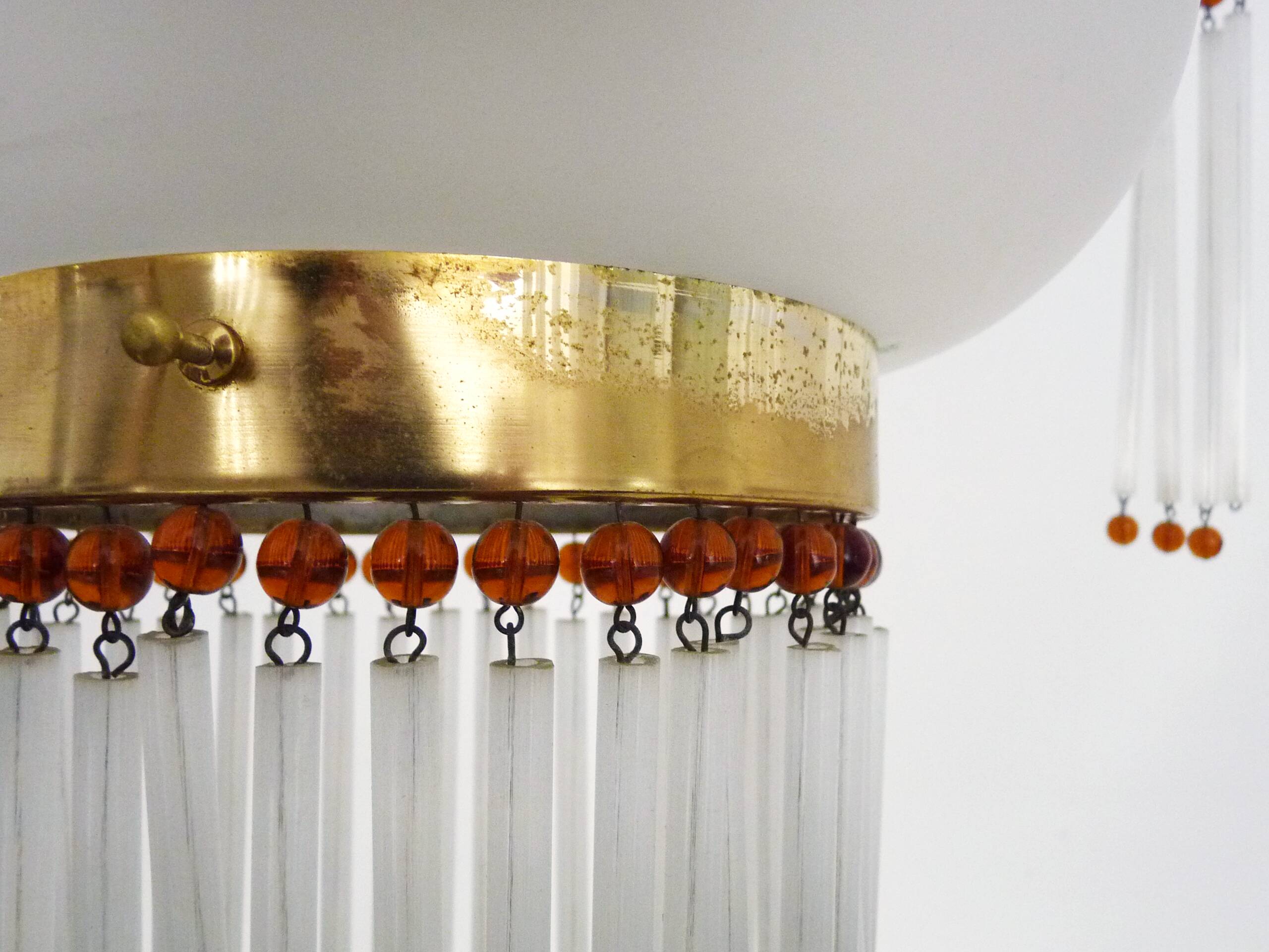 Art Nouveau style chandelier in brass with pendants and glass globe with 3 lights. Italy 70s 80s