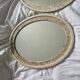 paire de miroirs ovales anciens
