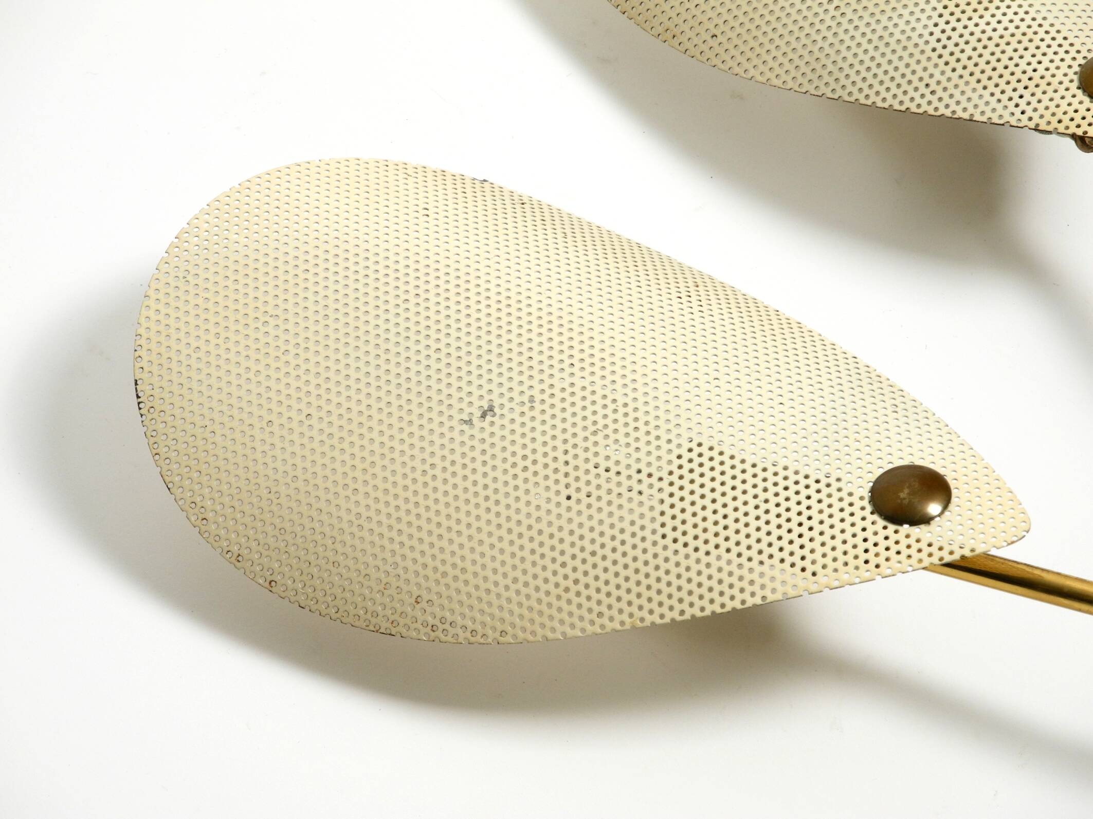 Mid Century Modern brass wall lamp with perforated metal sheet lampshades