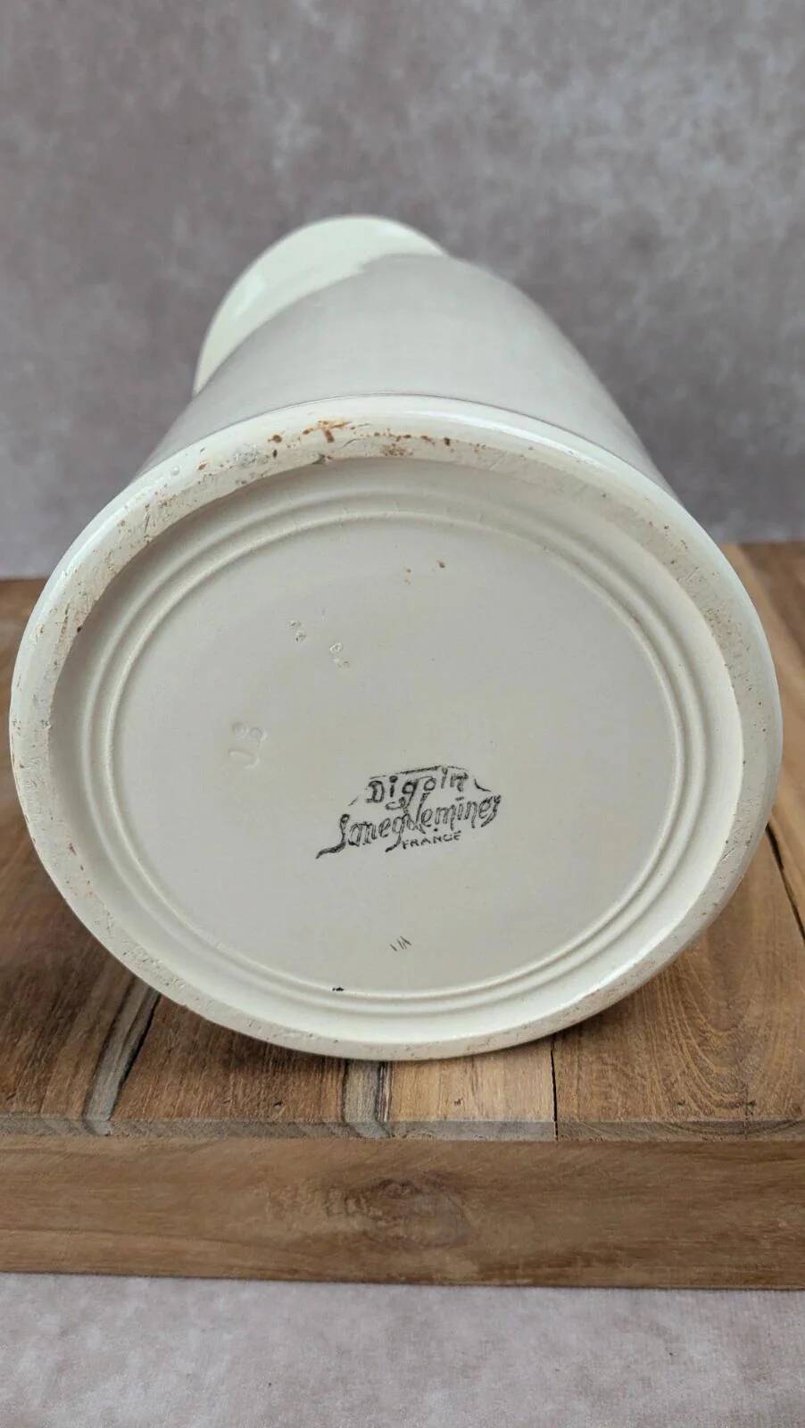 Large antique jug from Sarreguemines with golden trim.