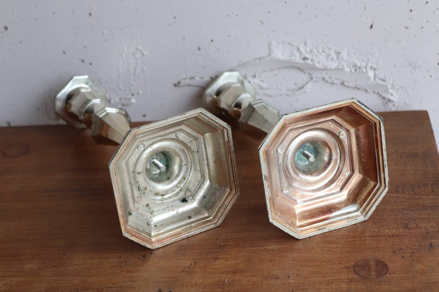 Pair of antique silver-plated metal candlesticks