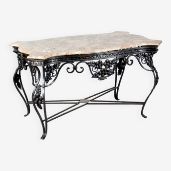 Wrought iron table with openwork flower belt. marble top