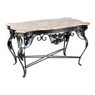 Wrought iron table with openwork flower belt. marble top