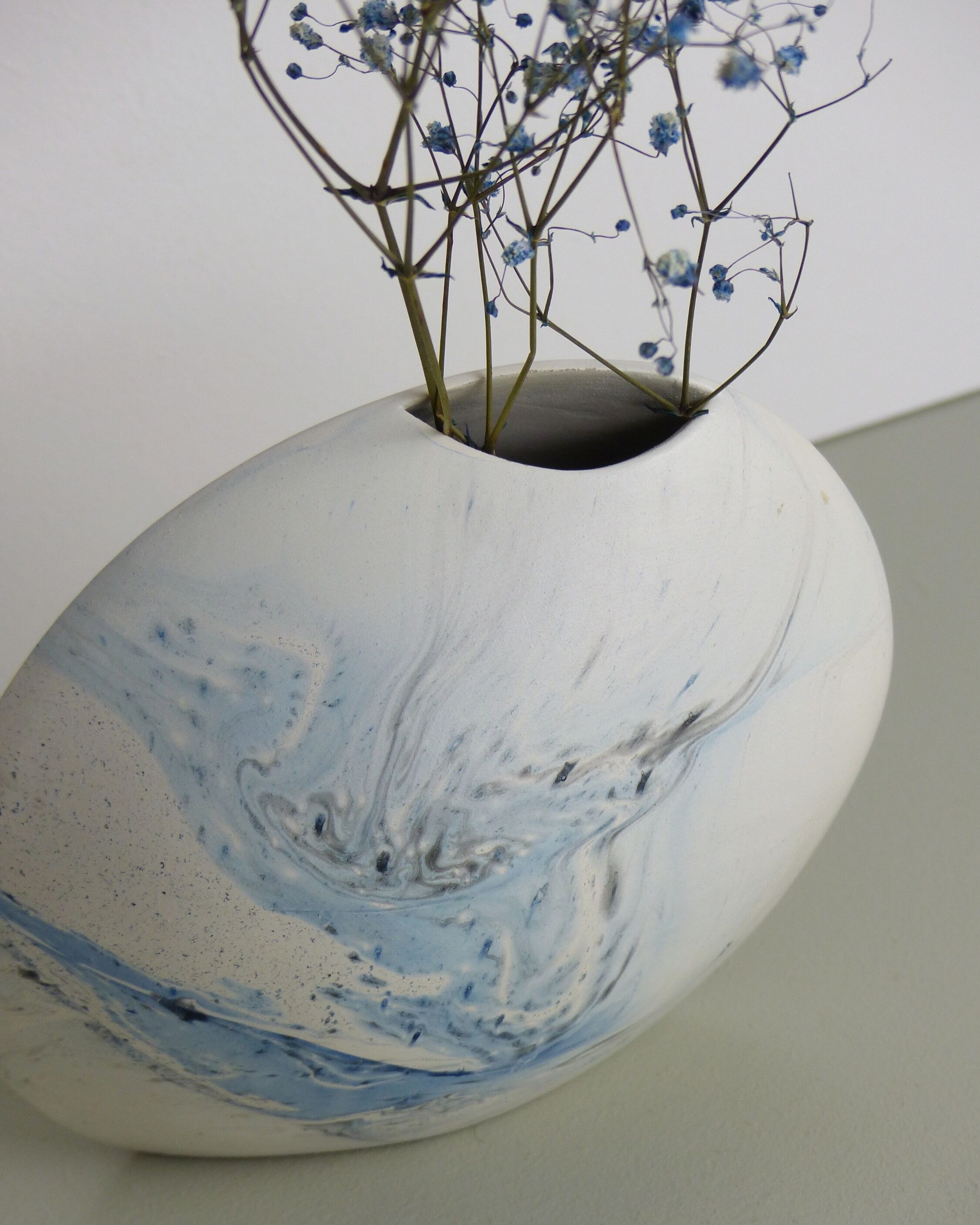 White and blue oval vase