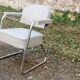 Set of 2 chairs and 1 armchair from the 70s in chrome metal and faux leather.