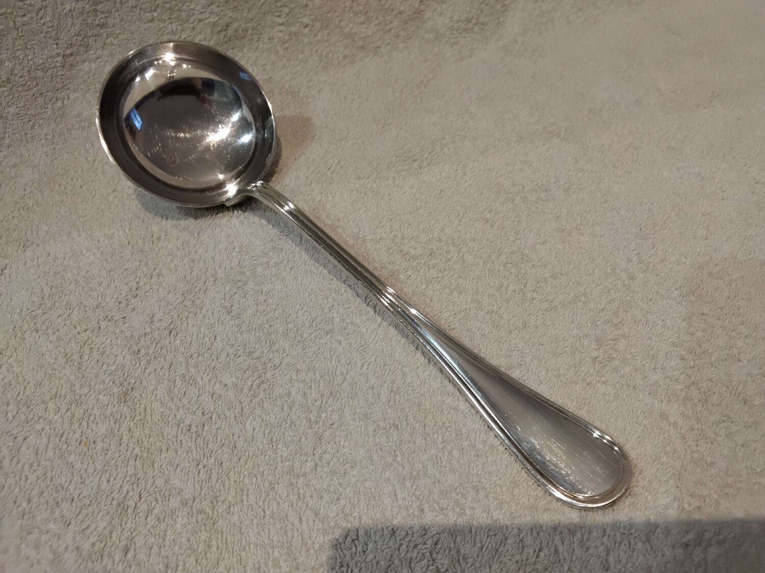 Silver-plated metal soup ladle by Christofle silversmiths, Albi pattern