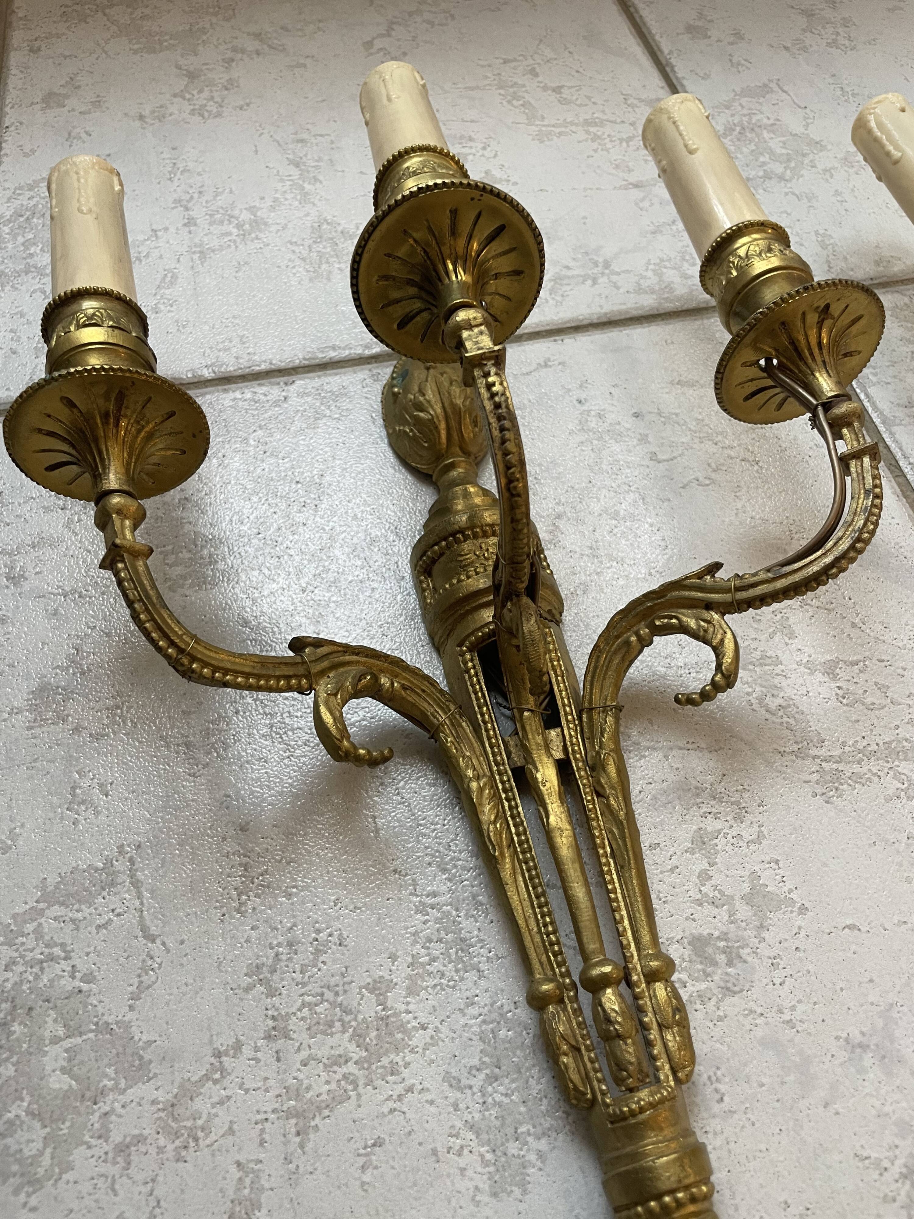 Pairs of Louis XVI bronze wall lamps