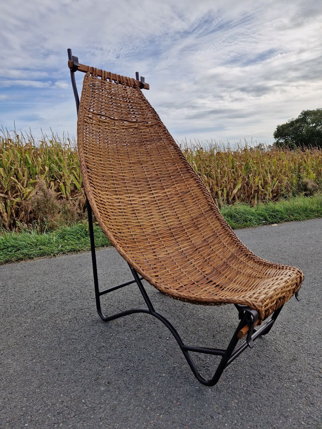 Large vintage metal and wicker armchair