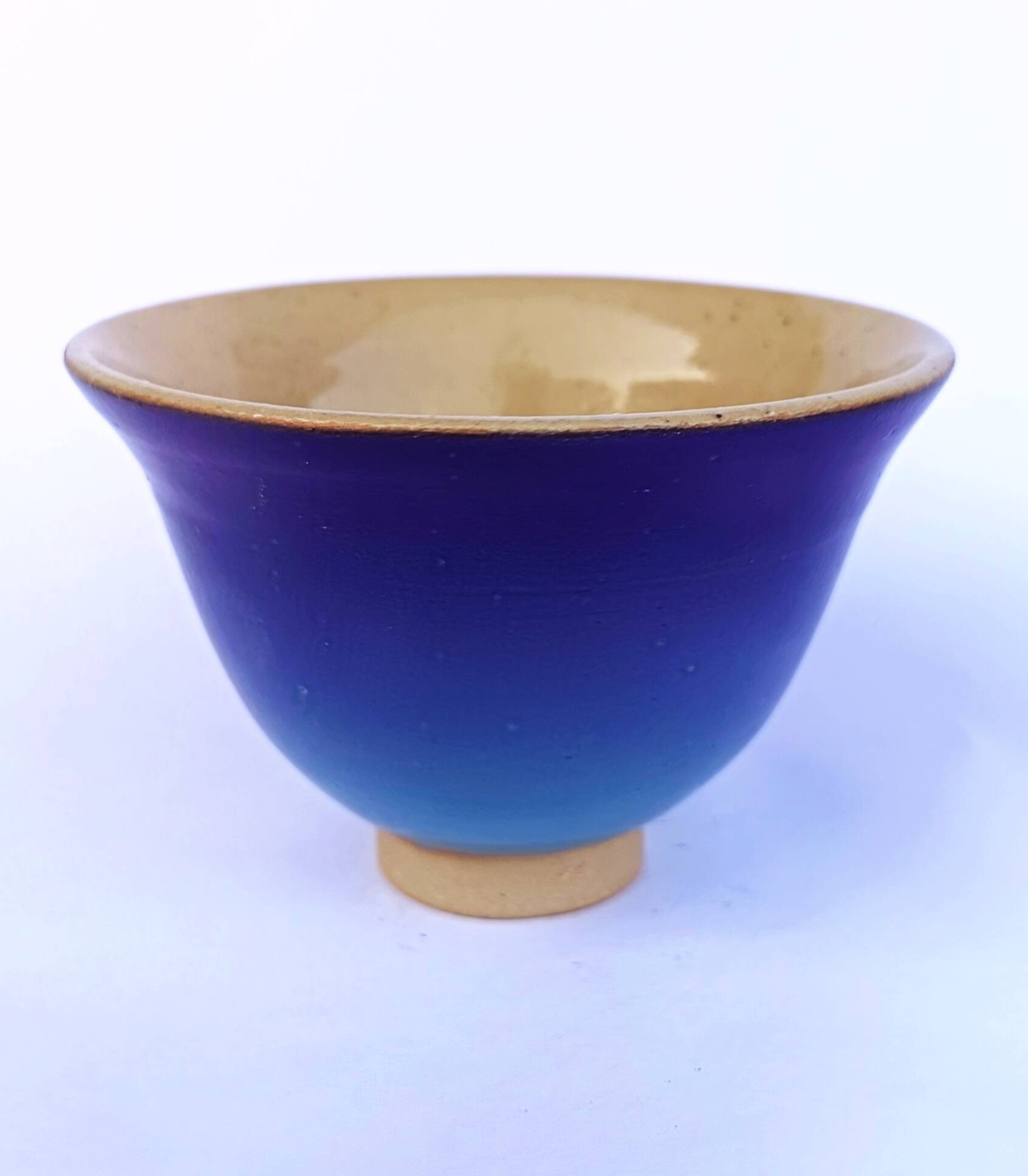 Blue glazed stoneware bowl on a foot, signed SP, Puisaye.