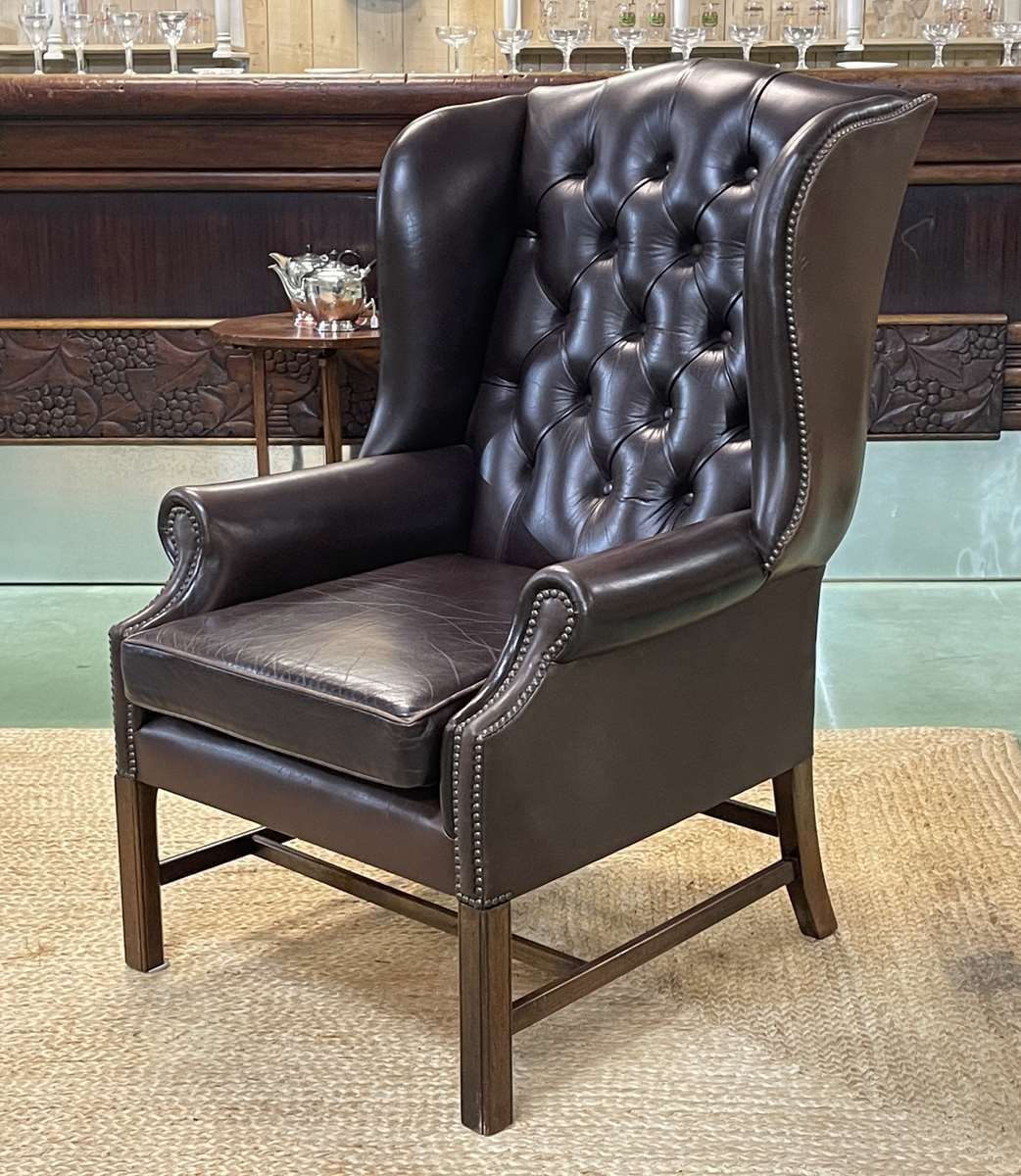 Chesterfield armchair with brown leather ears from the 1990s in very good condition