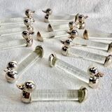 12 silver-plated metal duck knife rests with crystal.